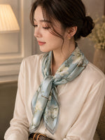 Model wearing Camellia Mist Blue 50 cm silk scarf