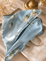 Camellia Mist Blue 50 cm mulberry silk scarf styled in a soft fold