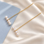 Gold chain earrings with four white pearls
